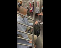 Man does bicep curls with backpack on train