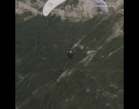 Collab risksIG - Guy swings and spins on parachute in the middle of mountains