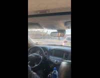 Guy rides bicycle balance wheel on head