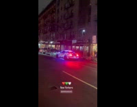 Parked car on street with Christmas lights