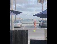Man orange bikini green heels dance restobar
