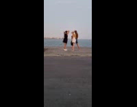 Collab IITW - Woman in dress poses by the beach