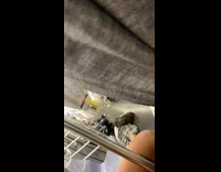 White shirt guy lays stomach subway floor