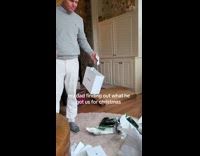 Dad checks his Christmas gifts for kids