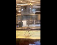 Girl watches cheese getting made 