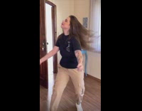 Lady tries to shake chest without bra 