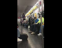 Guy spins around subway pole upside down 