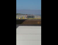Woman black bikini dance on pier beach