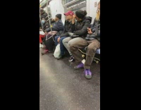 Black beanie lady brushes teeth on train 