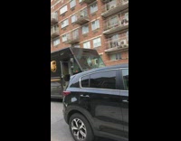 UPS driver talks to guy on fire escape balcony 