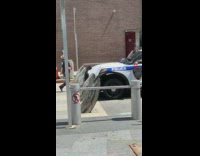 White NYPD car metal road block barrier