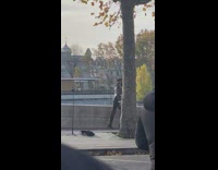 Woman in crop top jacket fur walks on the sidewalk