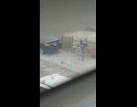 Two women dance  traditional clothes ladder car