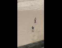 Guy black shirt dance on park sand