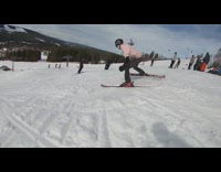 Skier squats, does a triple backflip off ramp, and lands