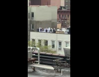 Group of nuns sing outside on rooftop 
