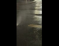 Manhole bubbling with flooded waters