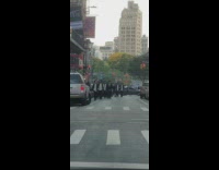 Men walks wear black suit at the street in NY 