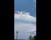 Cloud with rainbow colors in the sky
