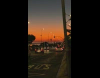 Person at bus stop film sunset sky