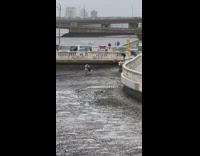 Woman pulled from sand beach Hurricane Ian