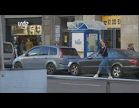 Black shirt girl jumps leaps across street 