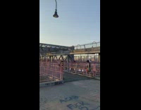 Blue shirt guy cuts lock off bicycle 