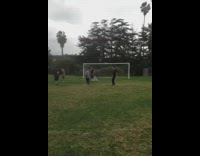 Guy kicks soccer ball hard and hits coach in the face