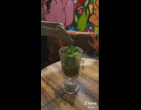 Person making barf noises when pouring out giraffe cup