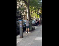 Man on meeting uses laptop on mailbox