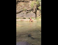 Girl pink bikini bend over split river