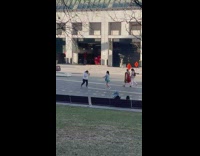 Girl grey shirt dance on street windy