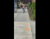 Guy walks on sidewalk with butt exposed 