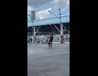 Guy rides on his unicycle along the park in new york 