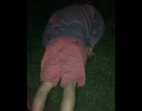 guy pink shorts with head on ground
