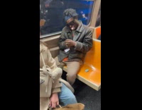 Man with pacifier inside the subway train