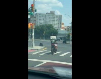 Collab WINY - Man drive motorcycle with microwave as helmet