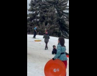 Man ski spin trick down the hill