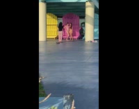 Two girls bikini photo shoot pink fence