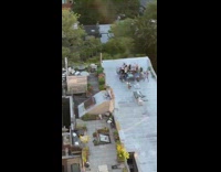 Friends have happy hour outside on rooftop 