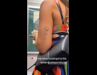 Arm hold wineglass tattoo of woman subway