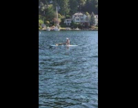Girl hat selfie sit on paddle board