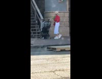 Woman takes picture from stroller 