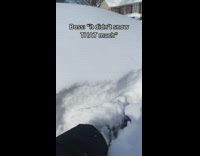 Red car covered in thick layer of snow 