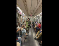 People ignore man singing and dancing on subway
