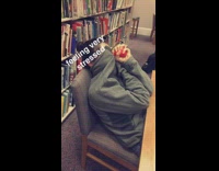 Girl covers face with jacket stress ball