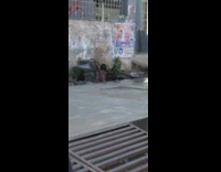 Little kid showers on the roadside tap water