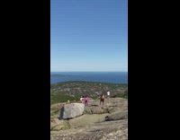 Man shirtless handstand kids family mountain top