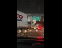 Collab WINY - Costco truck cross over the road median 