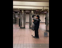 Man Dances with Skeleton Puppet in Subway Station